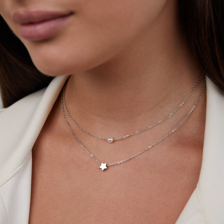 Layered silver star and pearl necklace