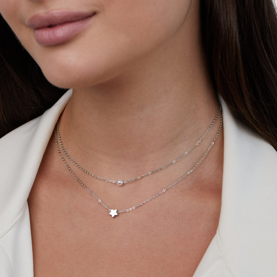 Layered silver star and pearl necklace